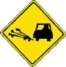 Gravel on road warning sign