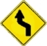 left double bend warning sign