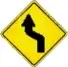 left double bend warning sign